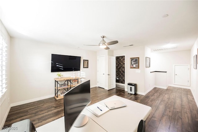 living room featuring dark hardwood / wood-style floors and ceiling fan