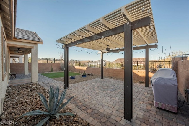 view of patio with a grill and a pergola