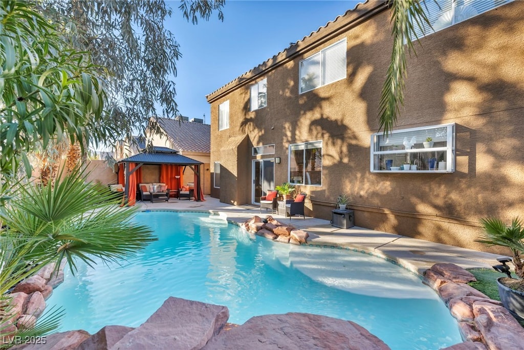 view of pool with a gazebo and a patio