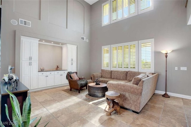 living room featuring a high ceiling