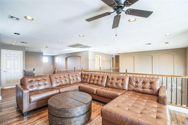 living room with ceiling fan and hardwood / wood-style floors