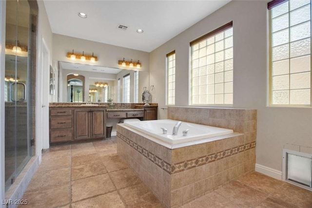 bathroom with separate shower and tub and vanity