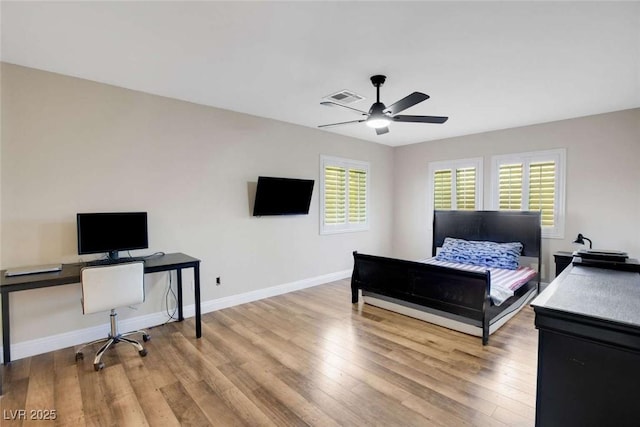 bedroom featuring ceiling fan and light hardwood / wood-style flooring