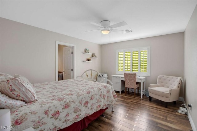 bedroom featuring ceiling fan and dark hardwood / wood-style floors