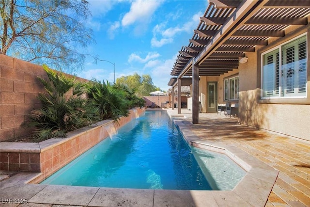 view of pool with pool water feature, a pergola, and a patio