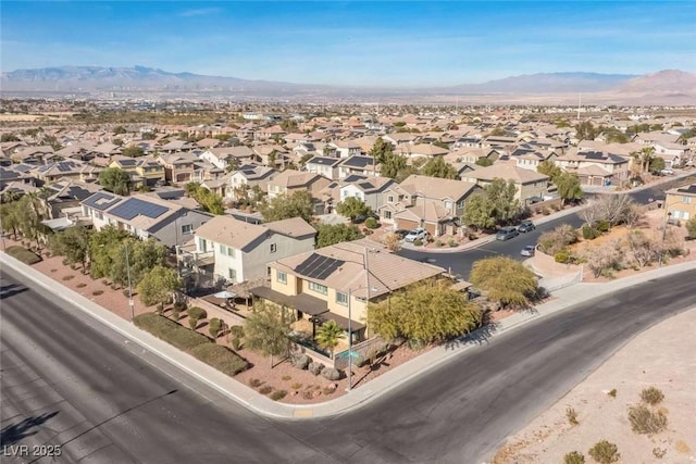 birds eye view of property with a mountain view