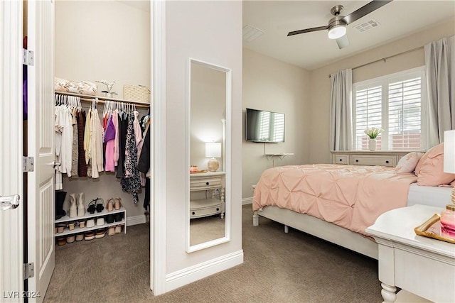 bedroom with ceiling fan, carpet flooring, and a closet