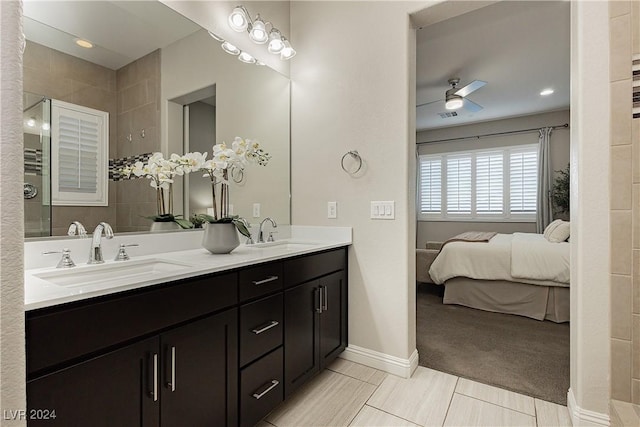 bathroom with ceiling fan, vanity, and tile patterned floors