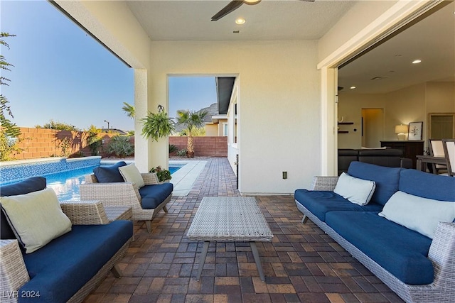 view of patio with ceiling fan, an outdoor hangout area, and a fenced in pool