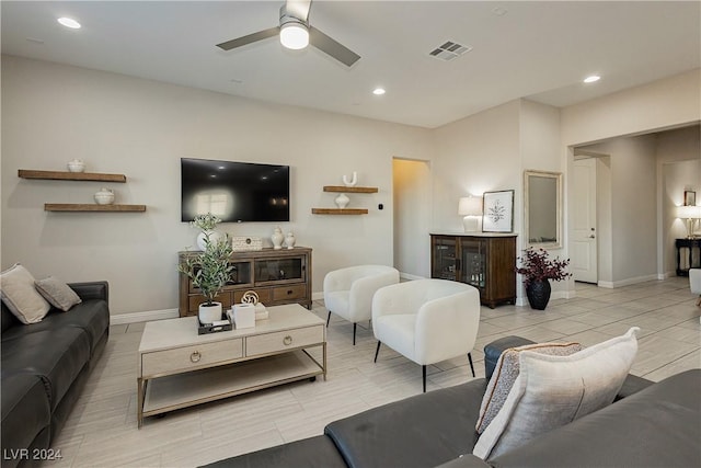 living room featuring ceiling fan and light tile patterned floors