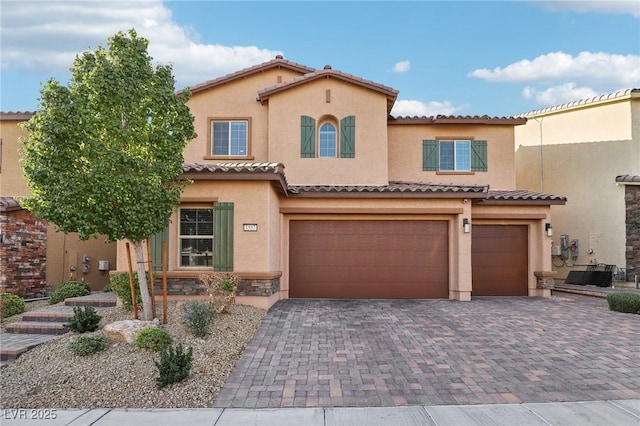 mediterranean / spanish-style house featuring a garage