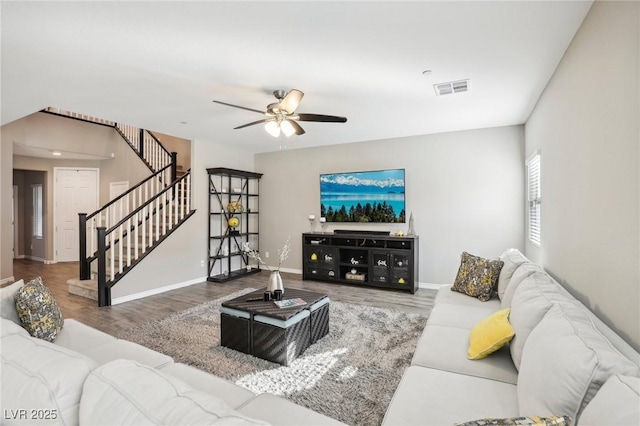 living room with ceiling fan and hardwood / wood-style flooring