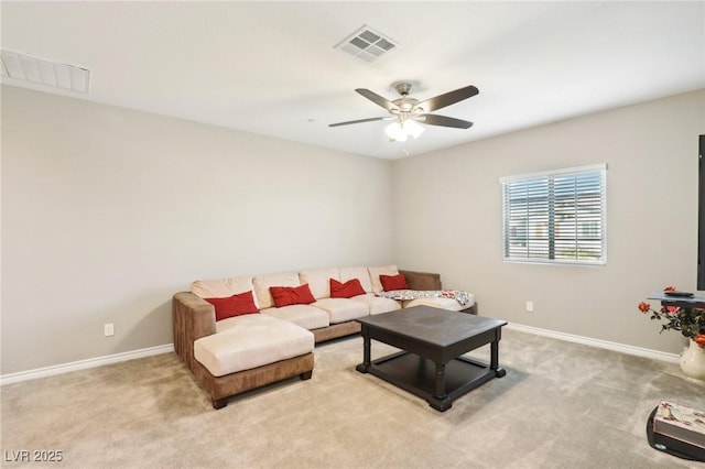 living room featuring light carpet and ceiling fan