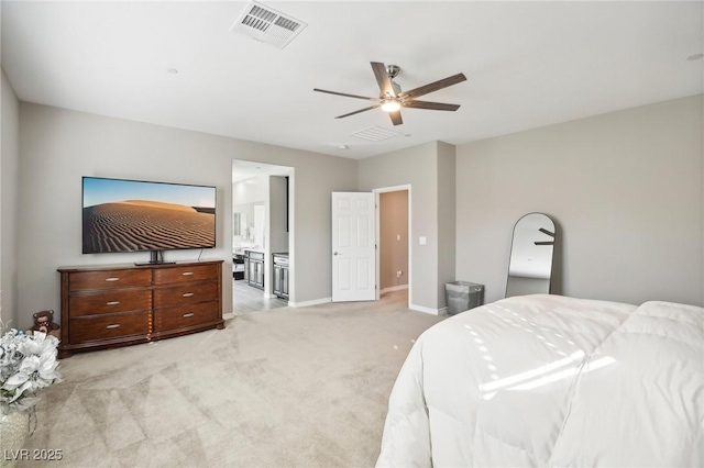 bedroom with light carpet, ceiling fan, and ensuite bathroom