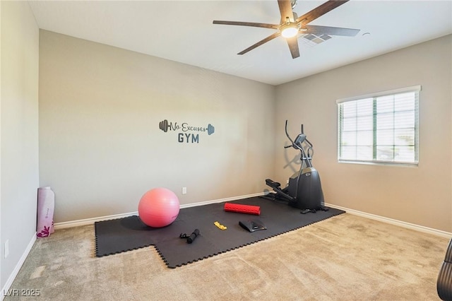 workout area featuring light carpet and ceiling fan