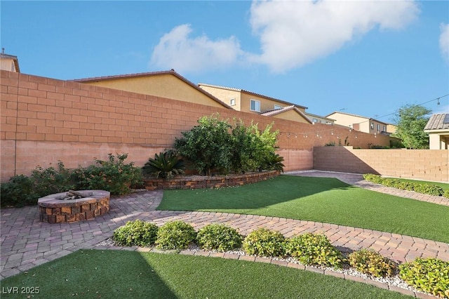 view of yard with an outdoor fire pit and a patio