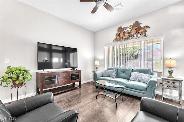 living room featuring wood-type flooring and ceiling fan