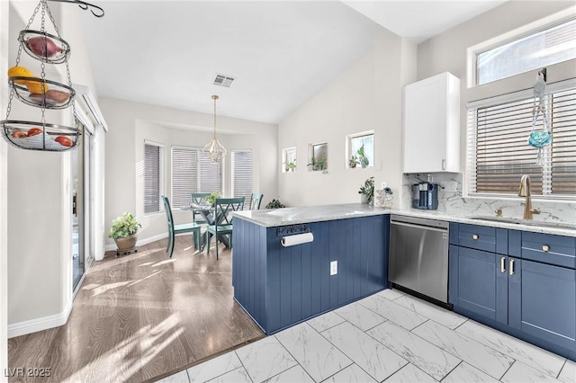 kitchen with sink, dishwasher, white cabinets, decorative light fixtures, and kitchen peninsula