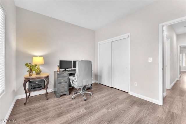 office with light hardwood / wood-style floors