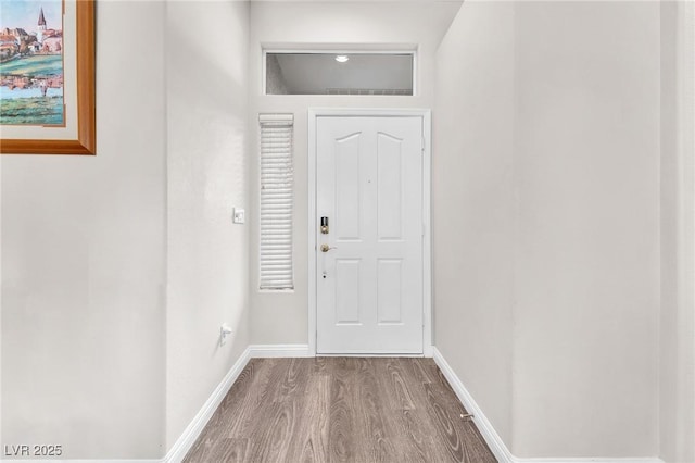 doorway to outside with wood-type flooring