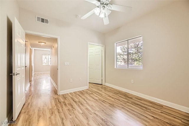 unfurnished bedroom featuring ceiling fan and light hardwood / wood-style floors