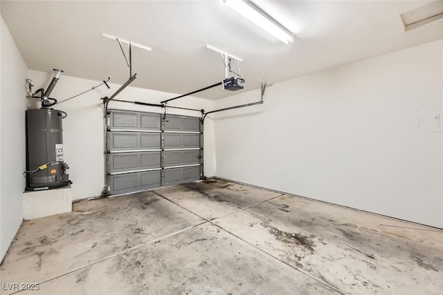 garage featuring gas water heater and a garage door opener