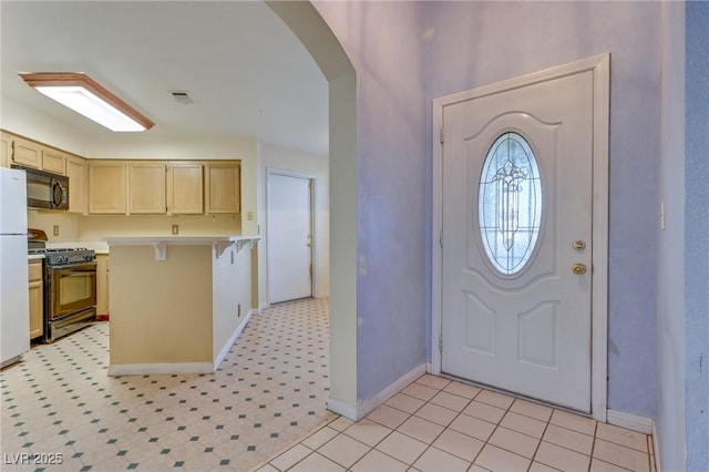 entryway featuring light tile patterned floors