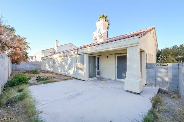 rear view of house with a patio