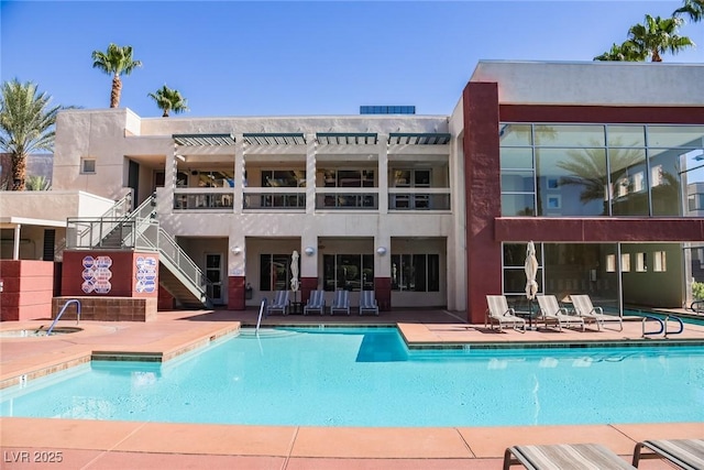 view of pool featuring a patio area and a pergola