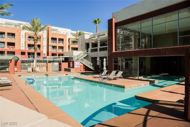 view of swimming pool with a patio area