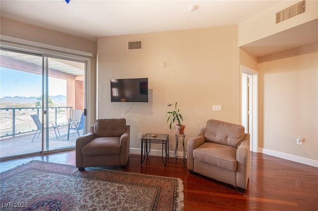 living room with dark hardwood / wood-style flooring