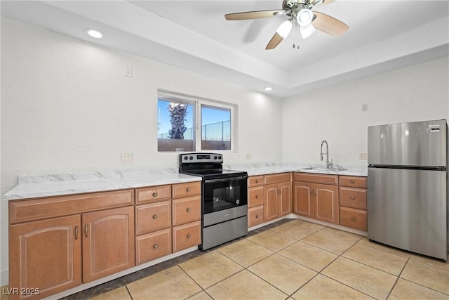 kitchen featuring ceiling fan, appliances with stainless steel finishes, sink, and light tile patterned floors