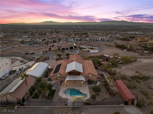 aerial view at dusk with a mountain view