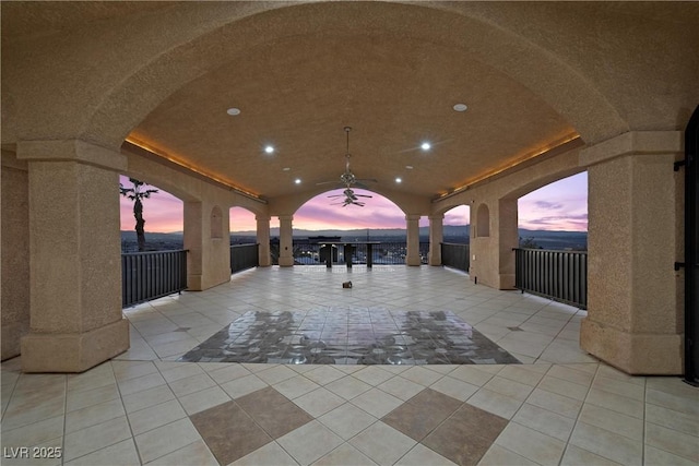 view of patio terrace at dusk