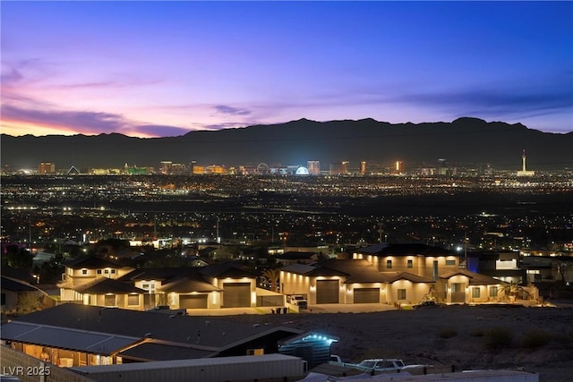 property's view of city with a mountain view