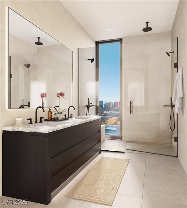 bathroom with vanity, a shower with door, tile patterned floors, and expansive windows