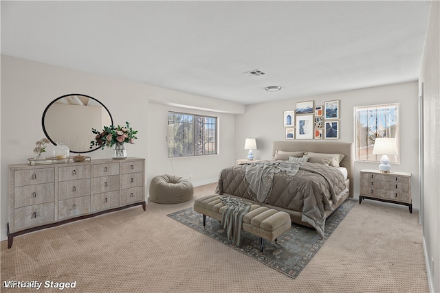 bedroom with light colored carpet