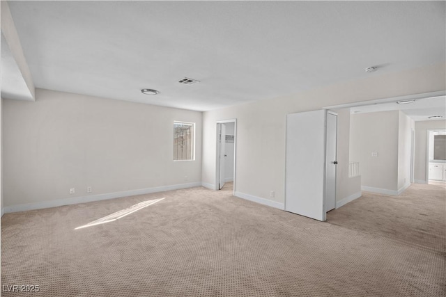 unfurnished bedroom featuring light carpet