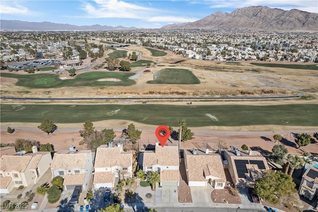 birds eye view of property featuring a mountain view