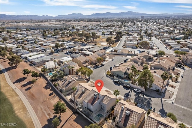 birds eye view of property featuring a mountain view