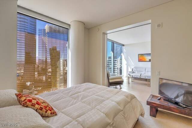 bedroom with a wall of windows