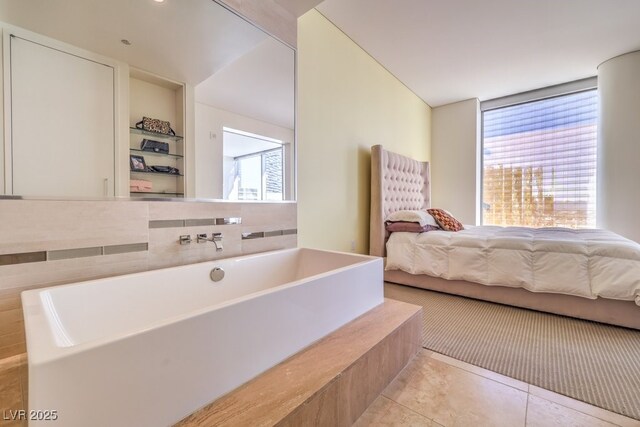 bedroom featuring light tile patterned floors