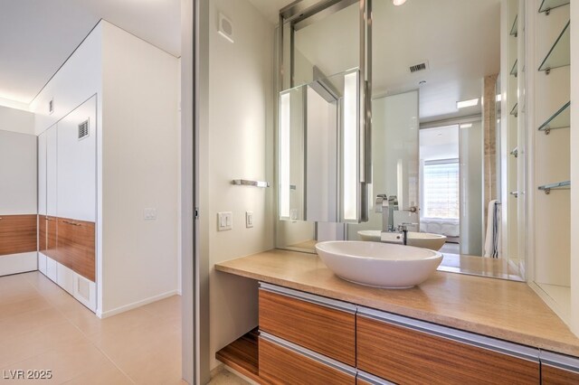 bathroom featuring vanity and tile patterned flooring