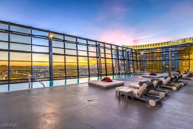 view of patio terrace at dusk