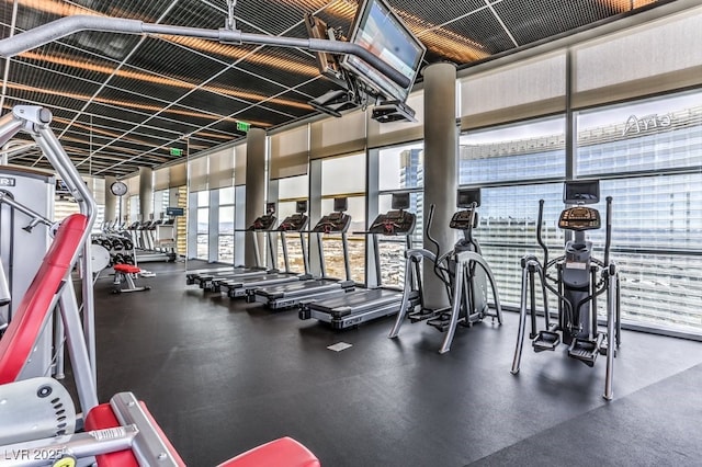 gym featuring a wall of windows