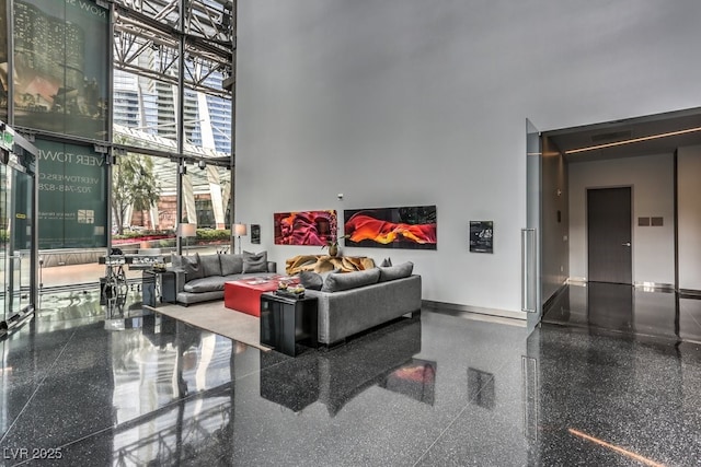 living room with a towering ceiling