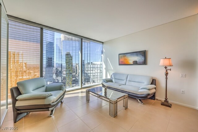 living room with light tile patterned flooring and expansive windows