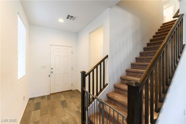 foyer entrance featuring dark wood-type flooring