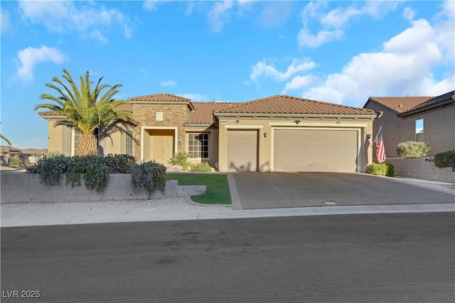 mediterranean / spanish house featuring a garage