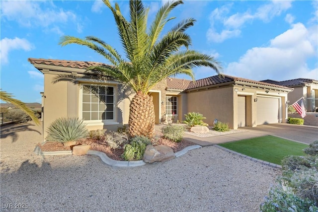 mediterranean / spanish house with a garage